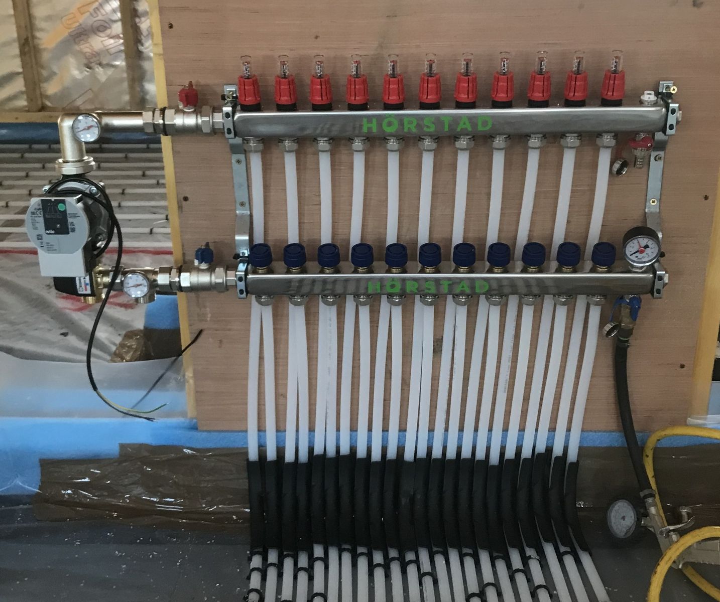 Building mechanicals from a Hydronic Radiant Floor Heating project near New York-Newark-Jersey City by Next Level Underfloor Heating and Screed Solutions