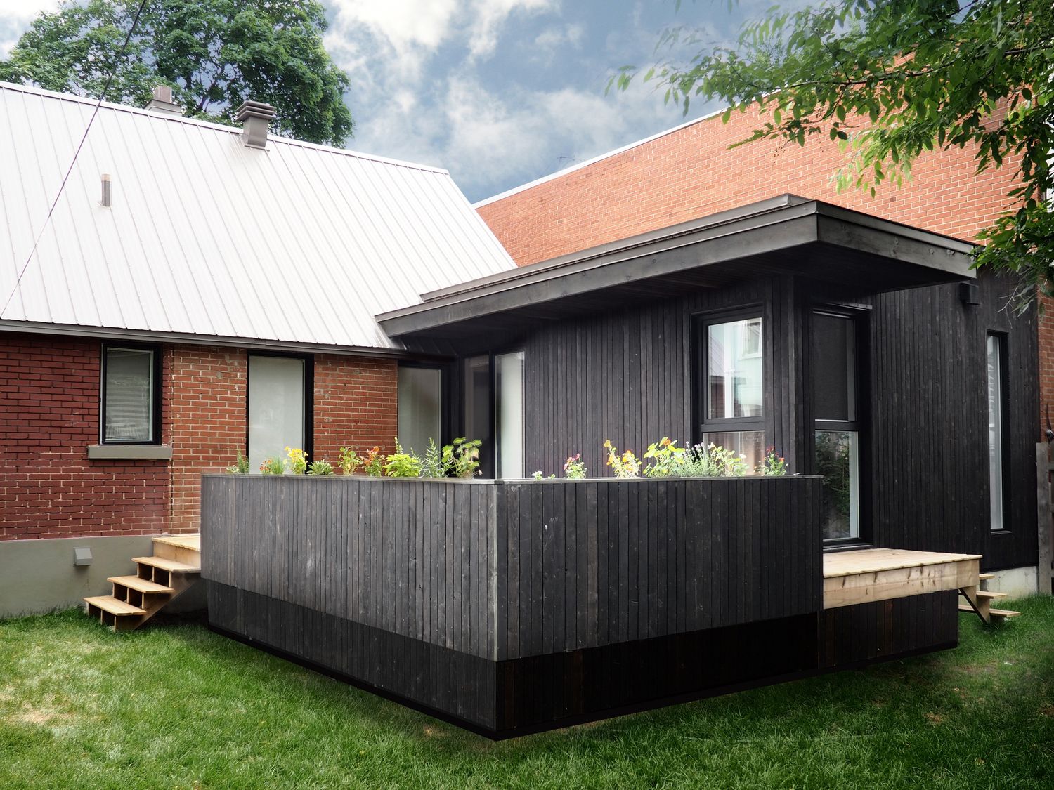 Backyard from a Home extensions project near Montreal (Greater Montreal) by MOA