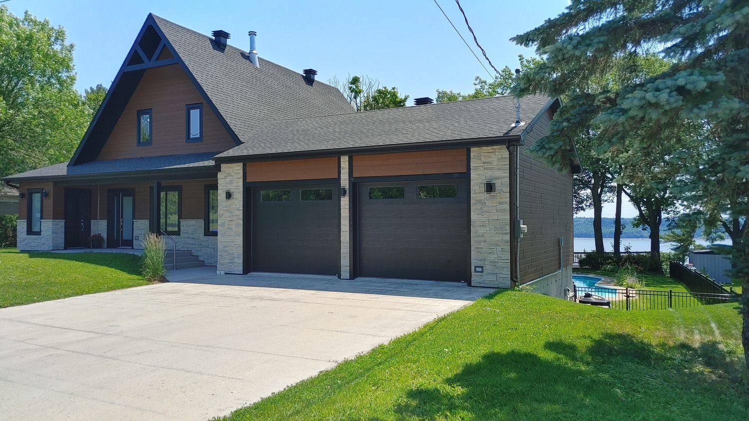 House Exterior from a Single family homes project near Quebec City - Levis by Construction Fruga inc.
