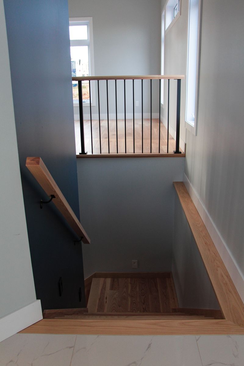 Staircase from a Single family homes project near Rimouski (Bas-Saint-Laurent) by Construction Norac