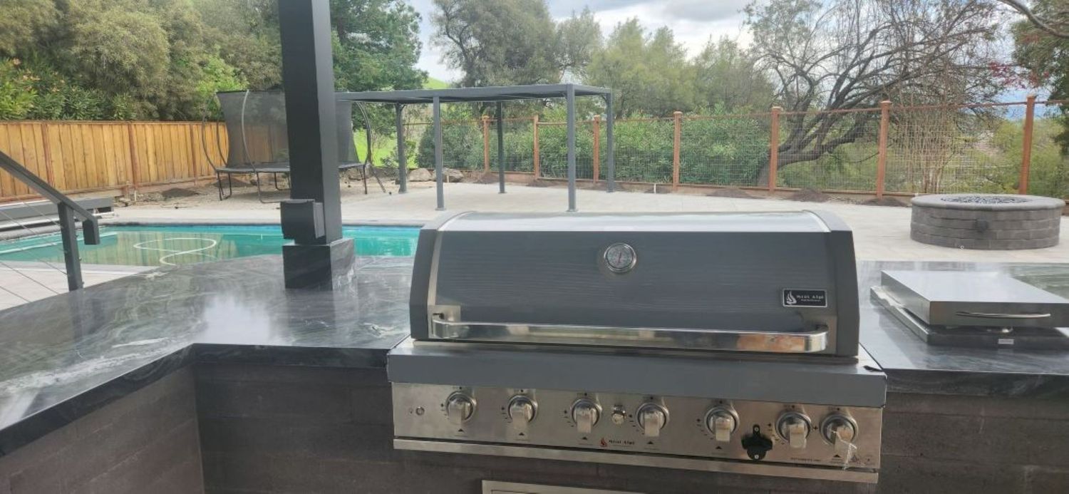 Backyard from a Outdoor Kitchens project near San Francisco Bay by Contractors Central