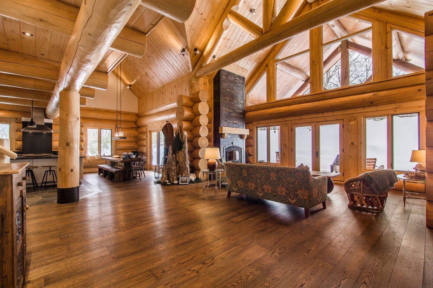 Living Room from a Log Houses project near Montreal (Greater Montreal) by Harkins inc. - Bois rond & Charpenterie