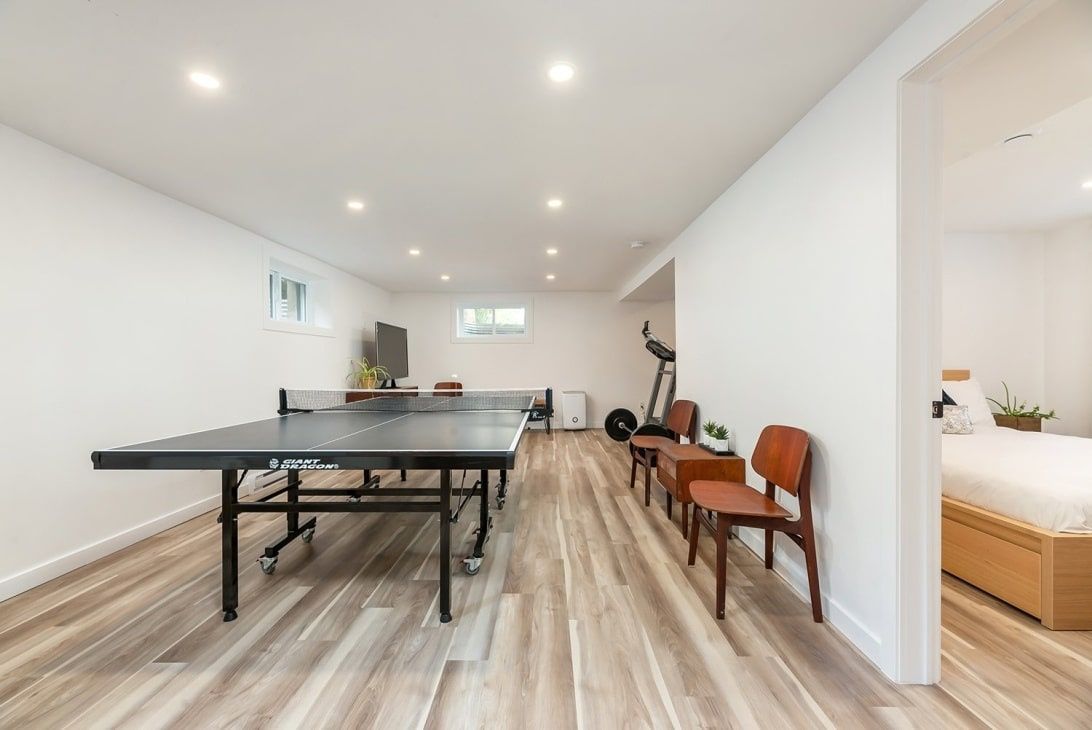 Salle familiale d'un projet de Maisons unifamiliales près de Montréal/Laval/Longueuil (Grand Montréal) de psb Inc.
