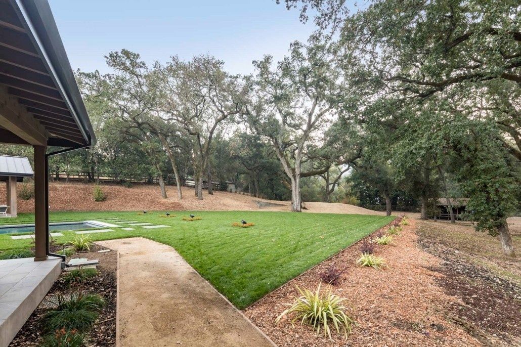 Backyard from a Landscaping around a pool project near San Francisco Bay by Contractors Central