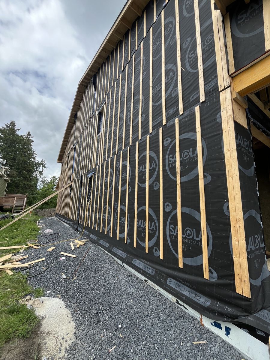 Construcción de exteriores de casas de un proyecto de tipo Sellado hermético cerca de Montreal (Gran Montreal) por Isolution Éco Construction