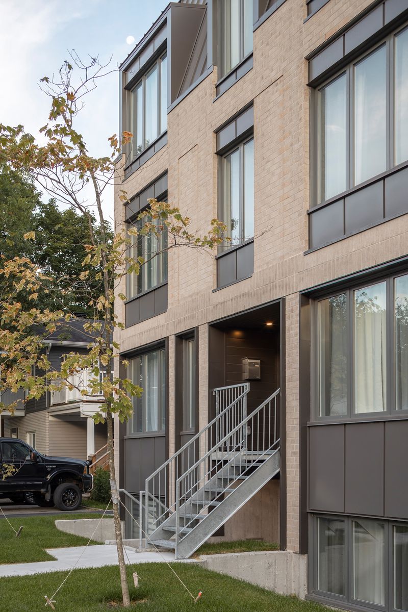 Fachada frontal de un proyecto de tipo Condominios, apartamentos cerca de Ciudad de Quebec - Lévis por Quinzhee Architecture