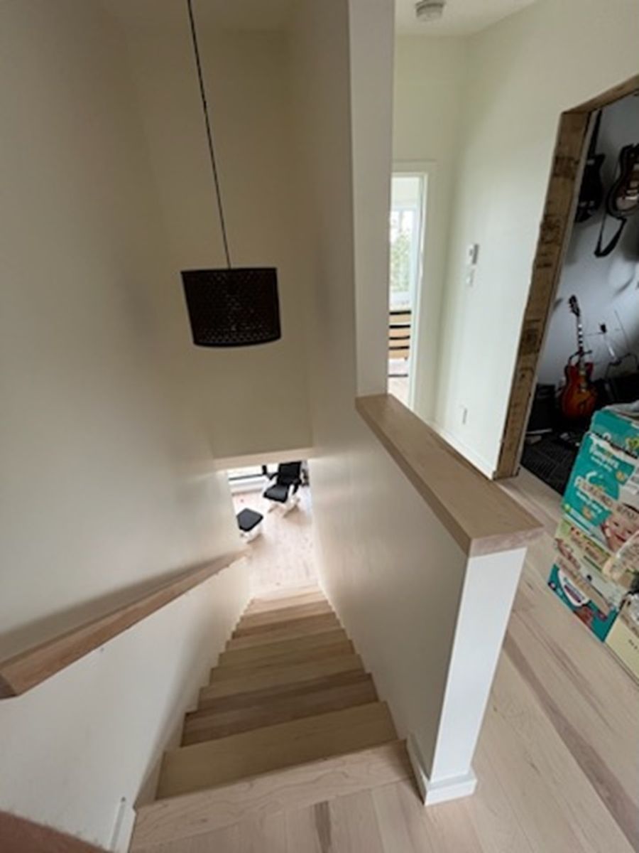 Staircase from a Single family homes project near Joliette (Lanaudière) by Construction Youri Durand inc.