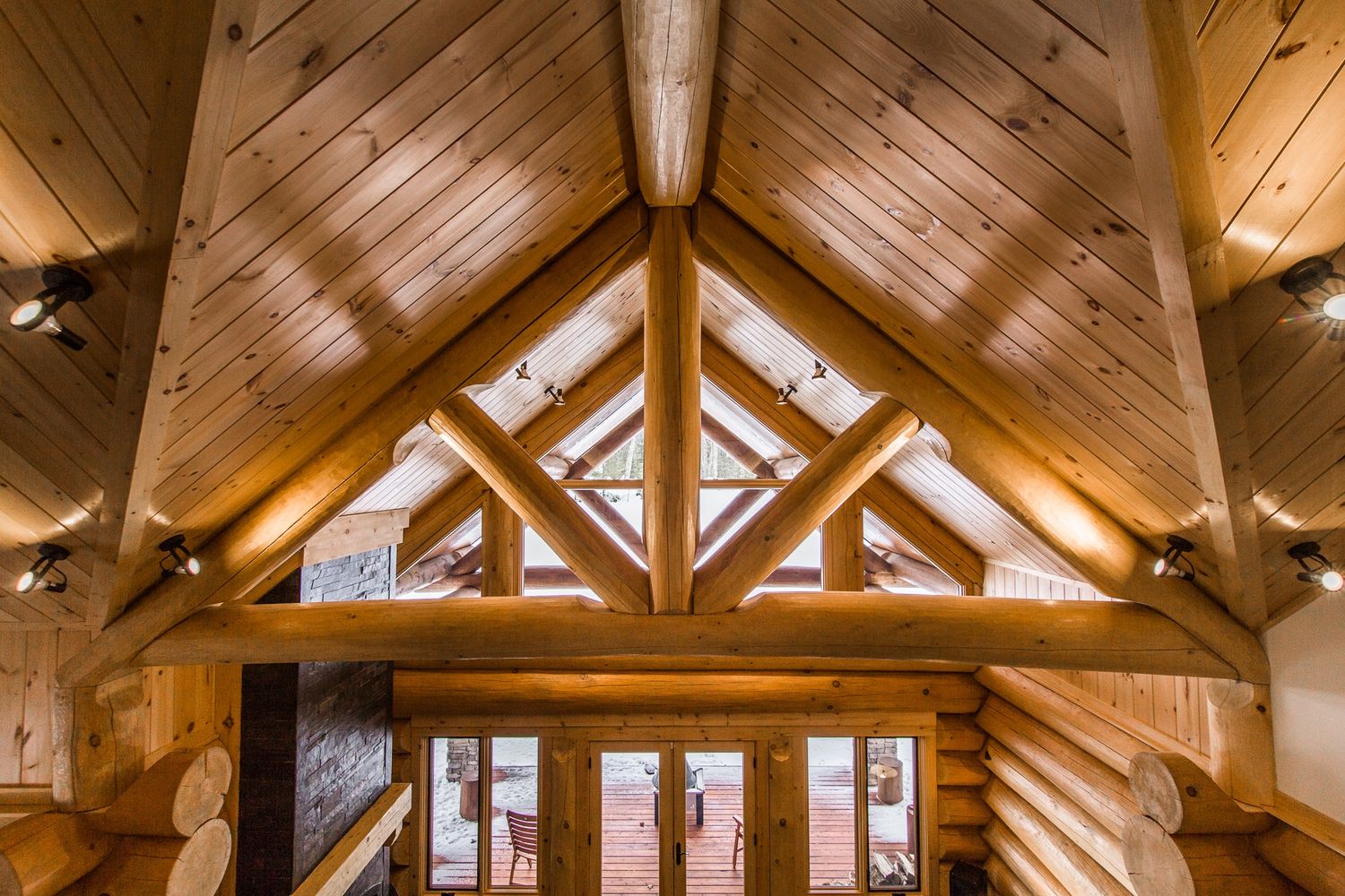 Entry Hall from a Log Houses project near Montreal (Greater Montreal) by Harkins inc. - Bois rond & Charpenterie