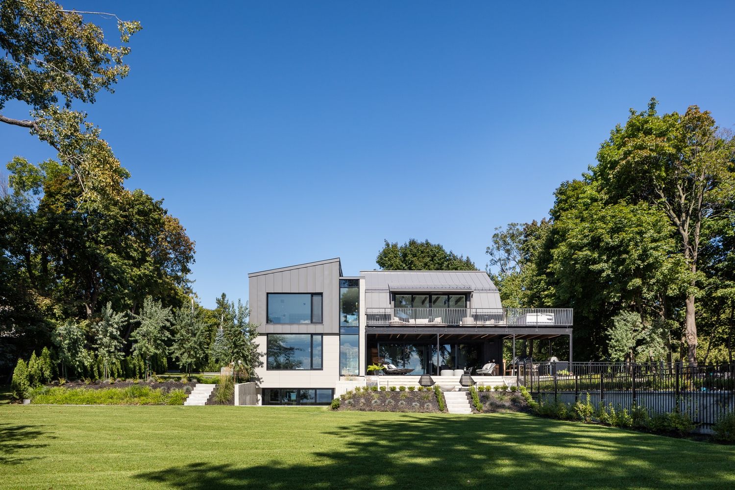 Backyard from a Home extensions project near Montreal (Greater Montreal) by GHOCHE ARCHITECTE
