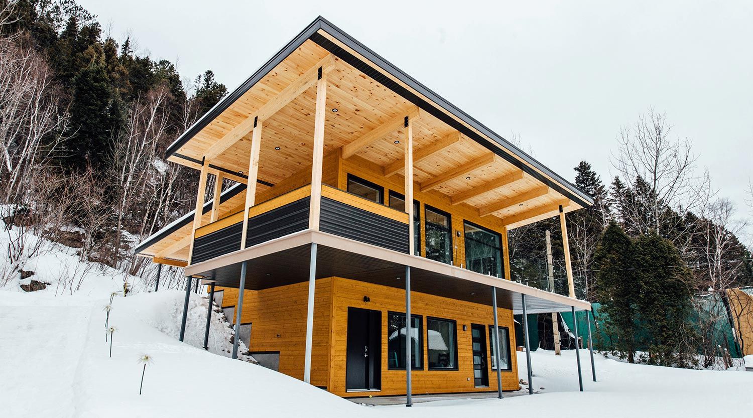 Façade avant d'un projet de Maisons unifamiliales près de Saguenay/Lac-Saint-Jean de Le Mur Porteur | Coopérative de travail