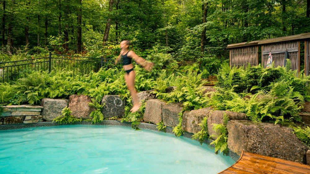 Pool & Natural Pond from a Landscaping around a pool project near Quebec City - Levis by Repères