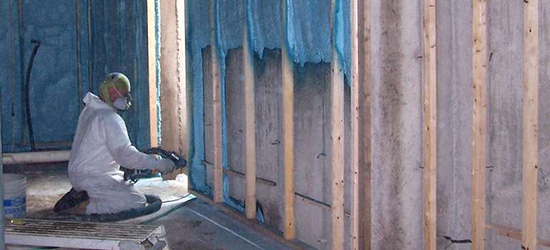 SPUF being installed correctly on basement walls to prevent mold