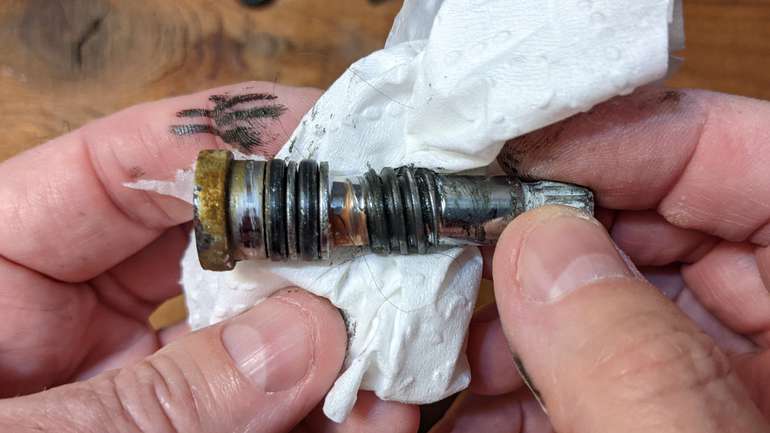 Inspect the bore of the faucet cartridge for damage and clean it out to prevent leaks