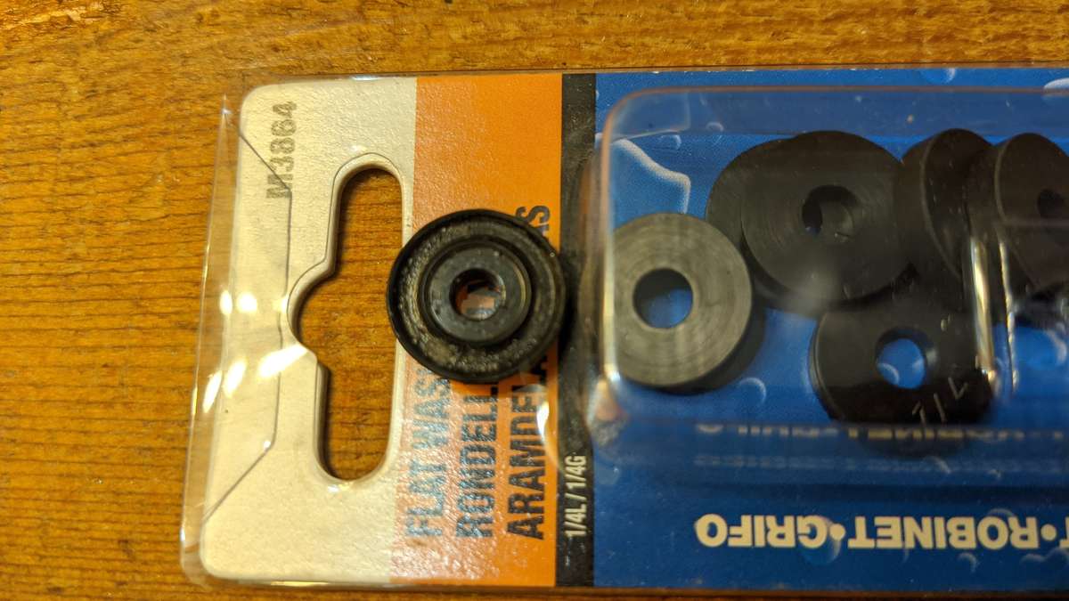 A new tap washer compared to the old one - no wonder that faucet was dripping!