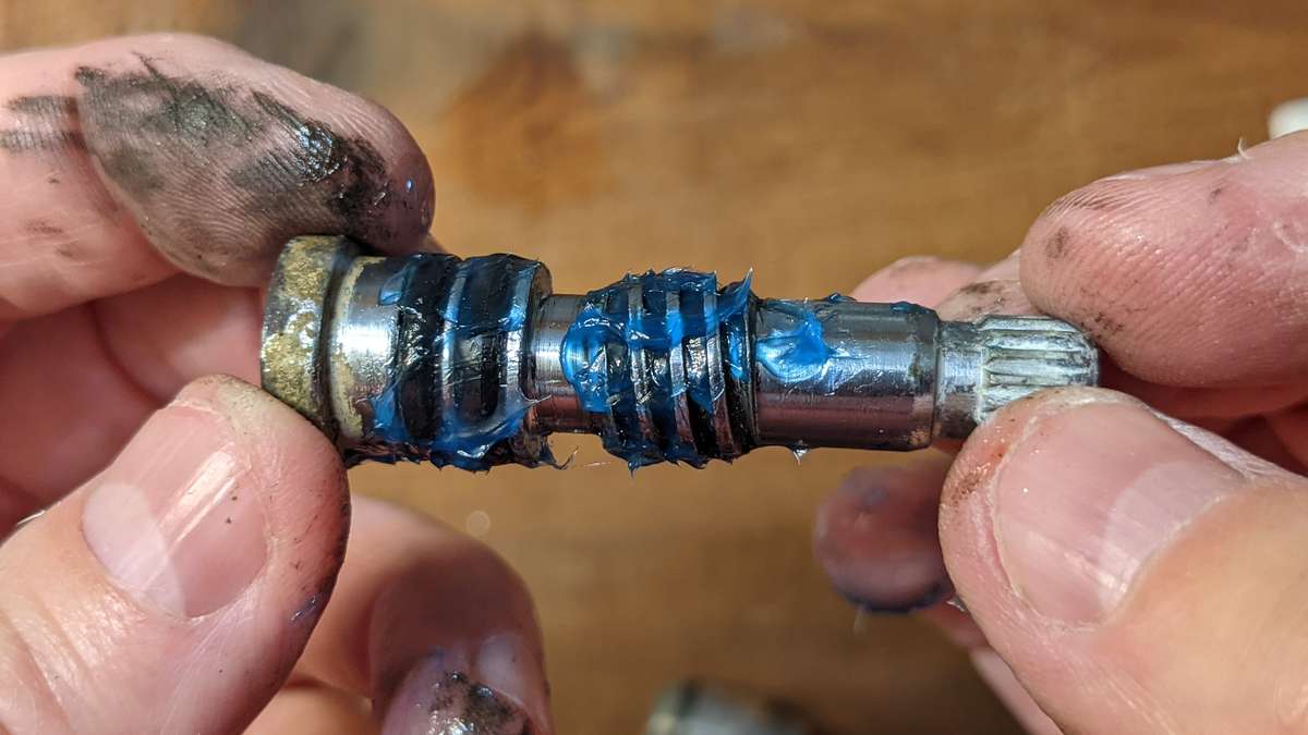 This is the faucet mechanism with fresh grease ready to screw back into the bore of the cartridge