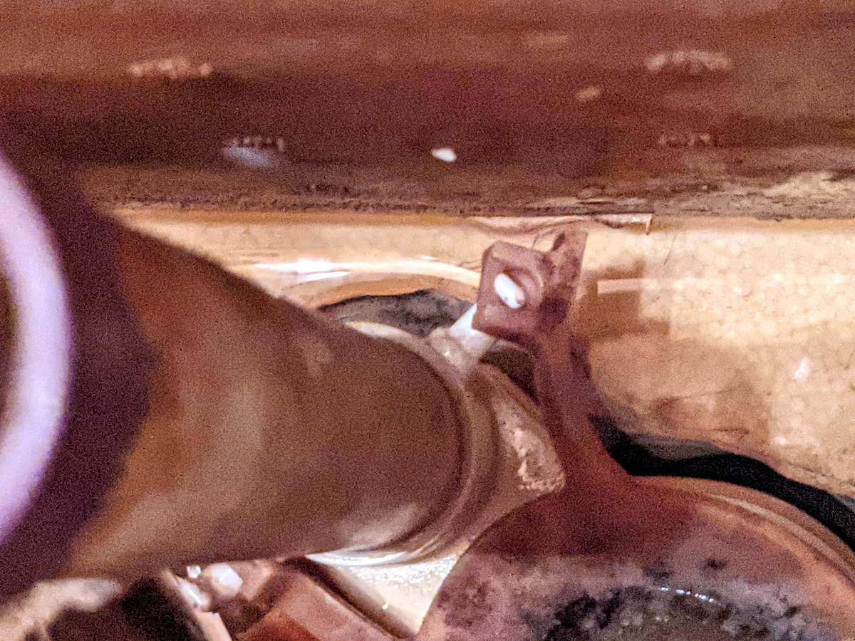 Toilet flapper replacement - carefully pry the ends of the flapper arms off their carriers