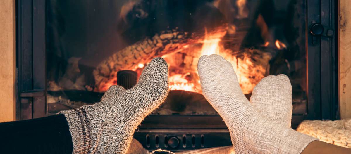 Warm socks and a roaring fire in a high efficiency wood burning fireplace are great ways to stay warm in a power outage