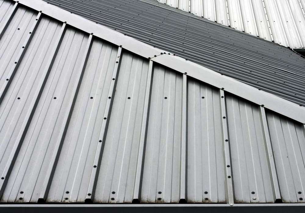 Where to put screws when installing metal roofing