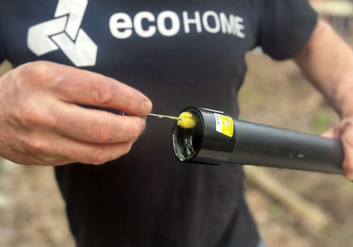 Put ABS glue inside of elbows and union joints when fastening pipes. - Image © Mike Reynolds