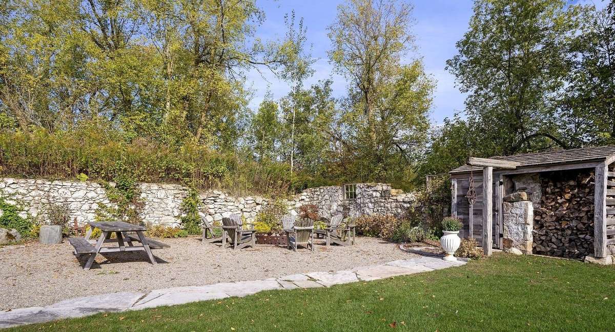 The remains of an 1800's barn provide an outside gathering place on the property