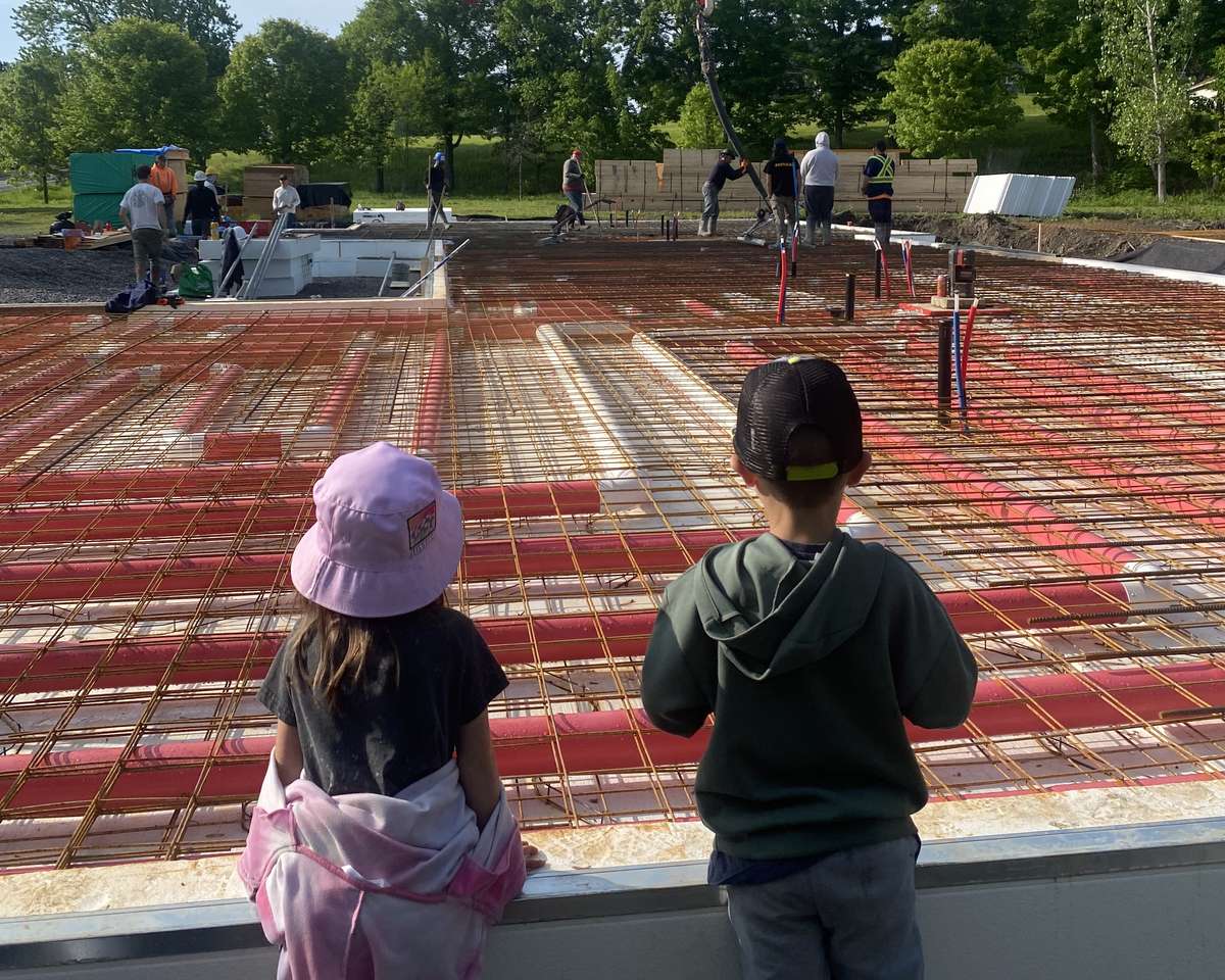 air heated monolithic raft slab being poured