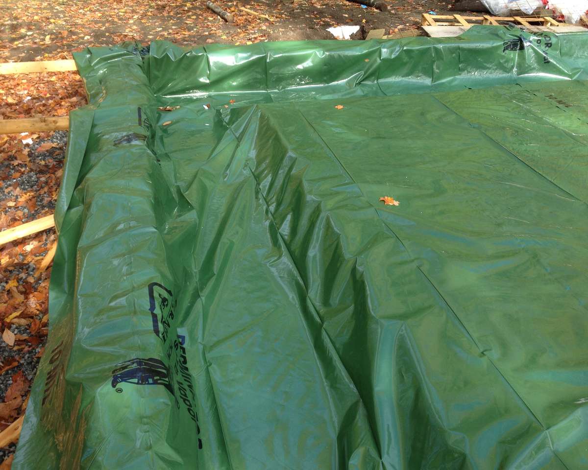 10 mil radon and vapor barrier over insulation for a monolithic slab on grade foundation