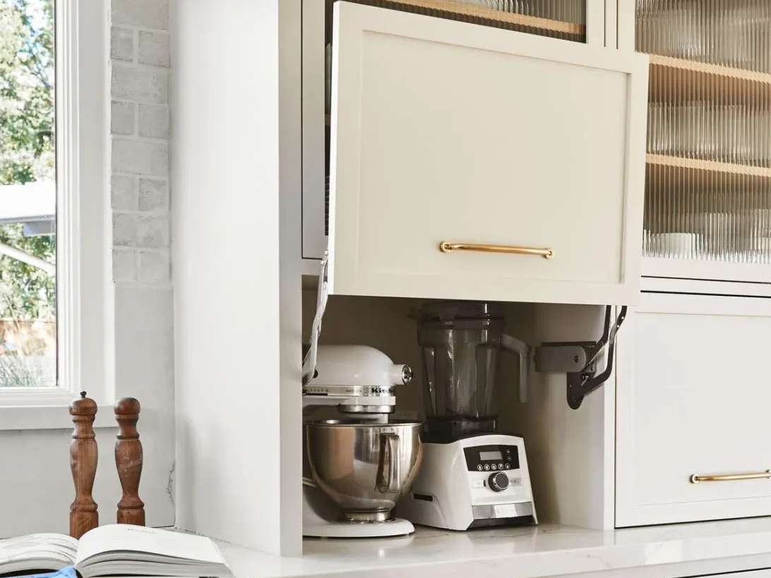 Appliance garage in a kitchen to store and hide small appliances