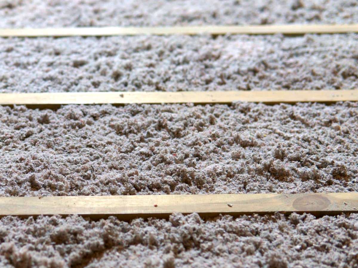 the floor of an attic with cellulose insulation