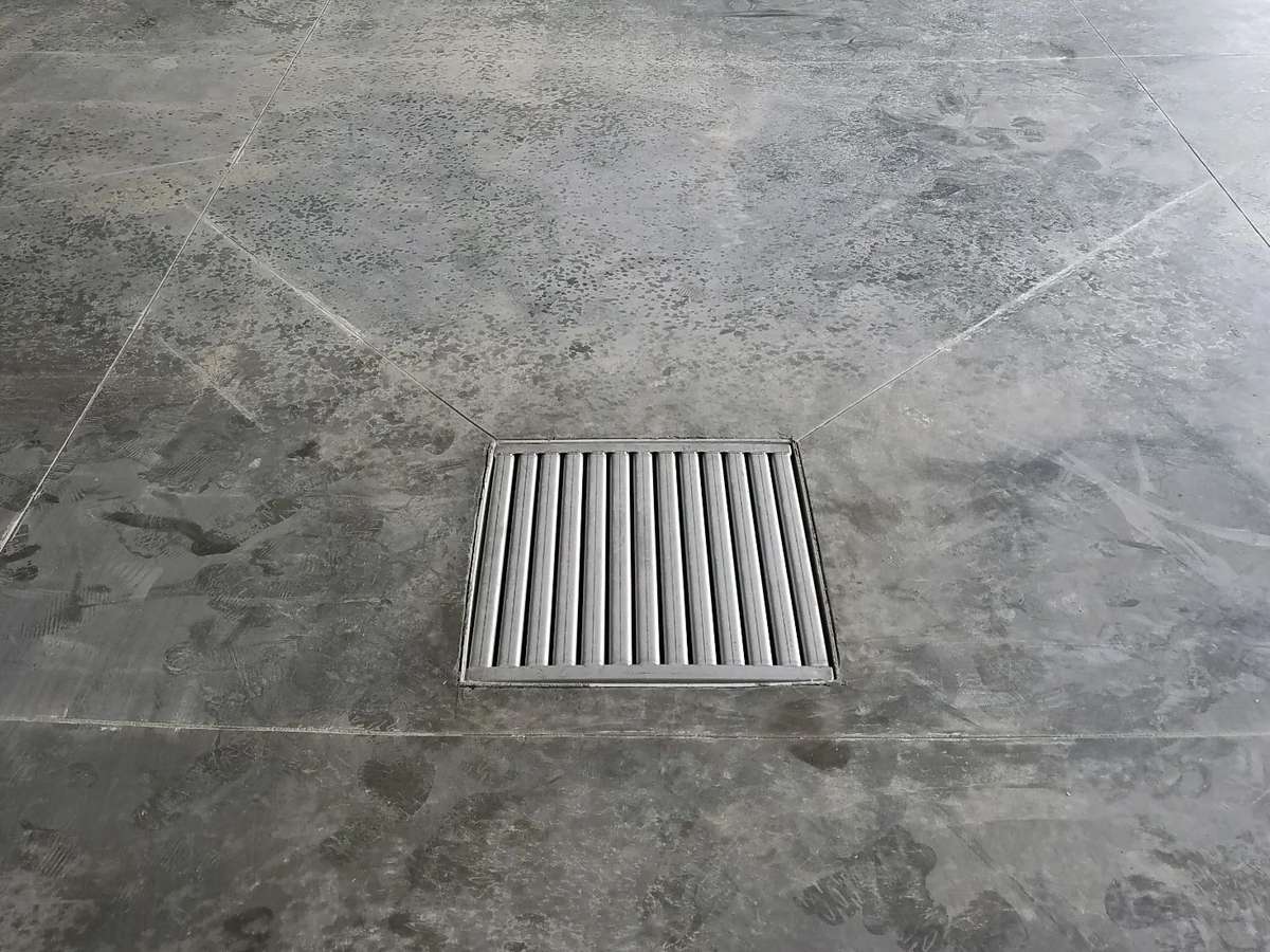 Catch basin in a home garage floor