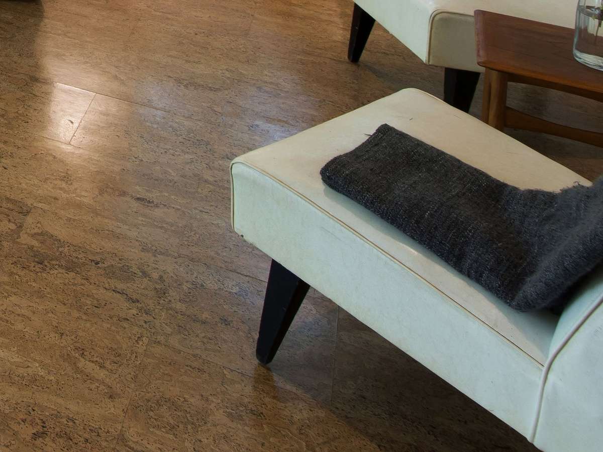 thin cork floor tiles glued to a concrete floor