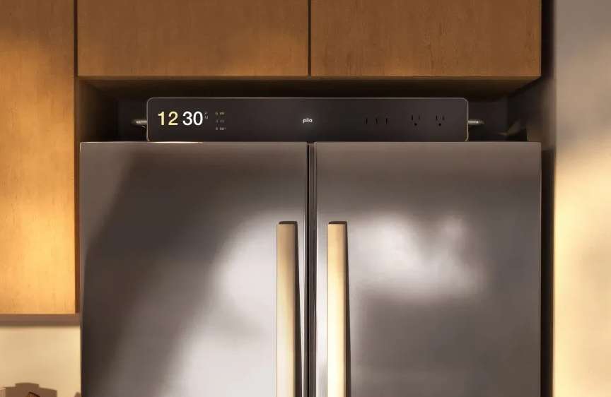Pila plug and play home battery on top of a fridge