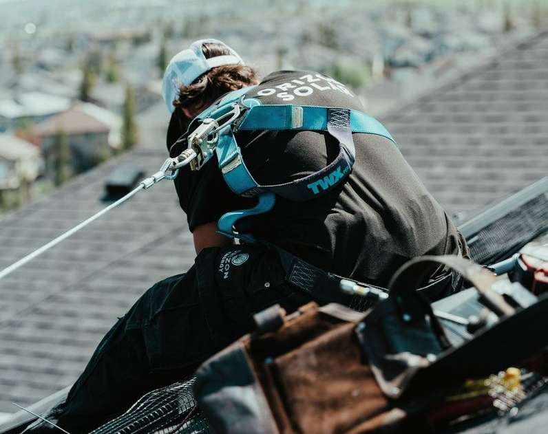 Rooftop solar panels being installed 